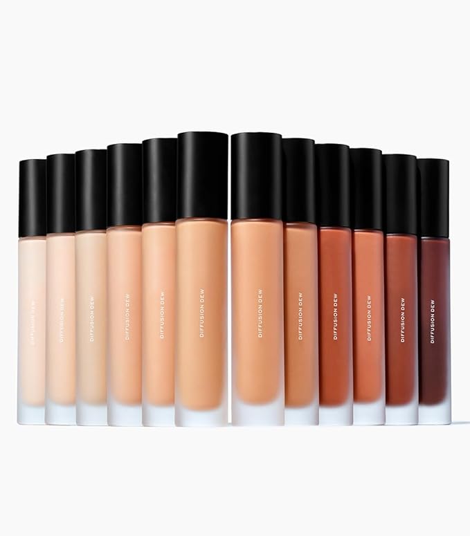 MAKE Beauty Diffusion Dew Skin Tint. Sheer to Medium Coverage Radiant Finish. Blurring, Smoothing, and Brightening for Glowing Complexion. Enhanced with Niacinamide and Adenosine. Rich Cocoa 18