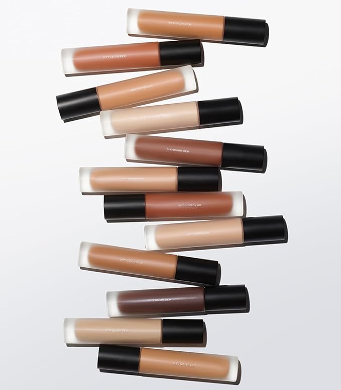MAKE Beauty Diffusion Dew Skin Tint. Sheer to Medium Coverage Radiant Finish. Blurring, Smoothing, and Brightening for Glowing Complexion. Enhanced with Niacinamide and Adenosine. Rich Cocoa 18