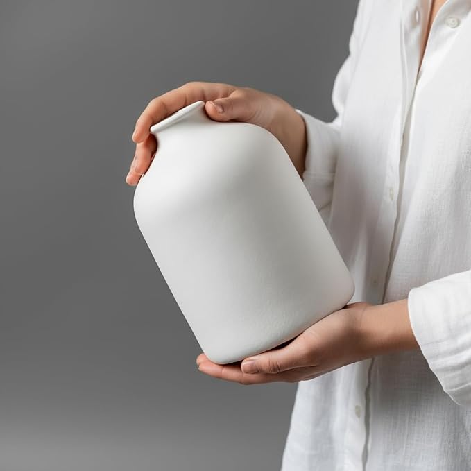 Carrot's Den White Ceramic Vase, Matte Textured Entryway Table Decor | Textured matte finish, 7 in tall. Holds olive branches, eucalyptus, or dried greenery on a coffee table or shelf.